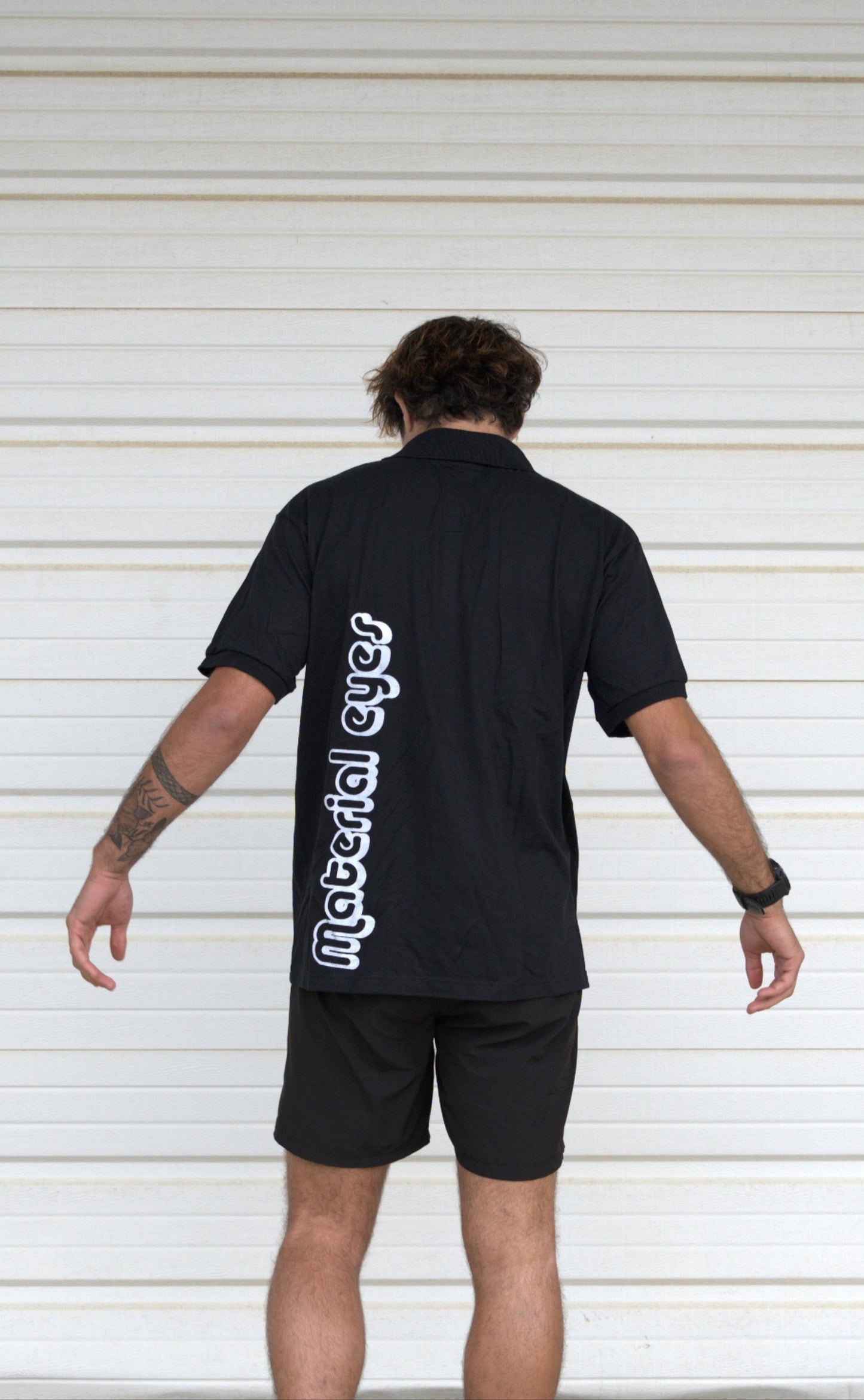 Material Eyez Black Short Sleeve Polo White font