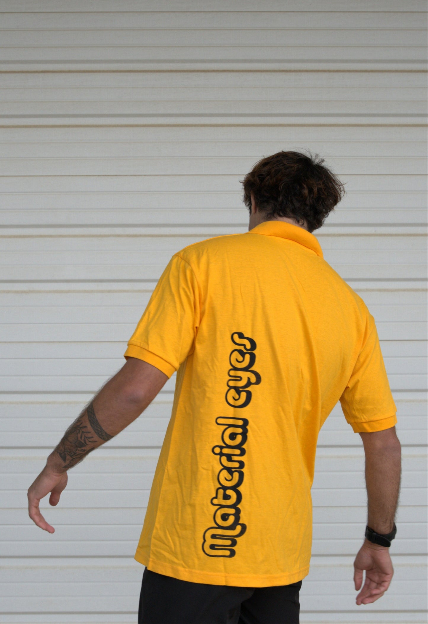 Material Eyez Yellow Short Sleeve Polo Black Font